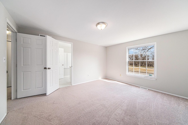 1019 Colony Dr, Saline, MI 48176 - unfurnished bedroom featuring visible vents, baseboards, and carpet