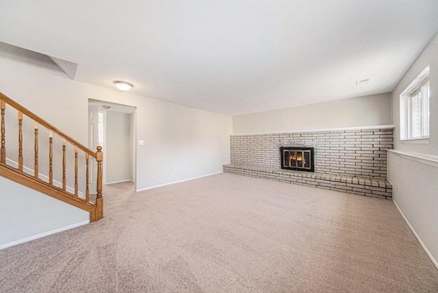 1019 Colony Dr, Saline, MI 48176 - unfurnished living room featuring stairway, a fireplace, baseboards, and carpet floors