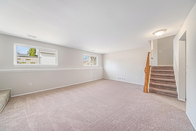 1019 Colony Dr, Saline, MI 48176 - interior space featuring visible vents, carpet floors, baseboards, and stairway