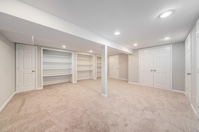 1019 Colony Dr, Saline, MI 48176 - finished basement featuring recessed lighting, baseboards, built in shelves, and carpet flooring