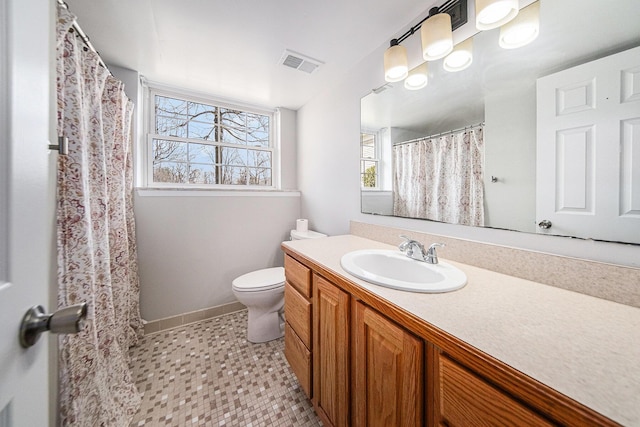 1019 Colony Dr, Saline, MI 48176 - bathroom with vanity, toilet, baseboards, and visible vents