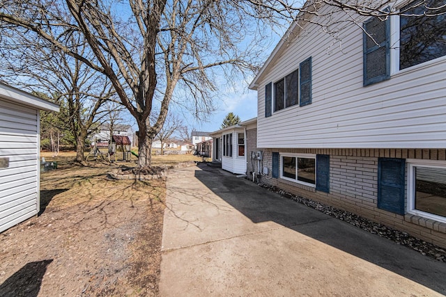 1019 Colony Dr, Saline, MI 48176 - view of side of home with concrete driveway