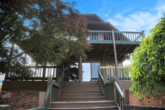 490 Skyline Dr, Horton, MI 49246 - view of front facade featuring stairway and a deck