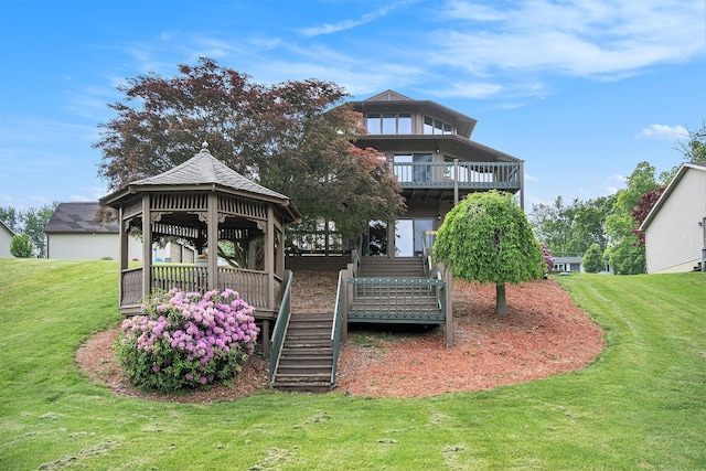 490 Skyline Dr, Horton, MI 49246 - back of property with a gazebo, stairs, and a lawn