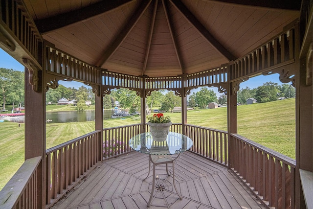 490 Skyline Dr, Horton, MI 49246 - wooden deck featuring a gazebo, a water view, a lawn, and view of scattered trees