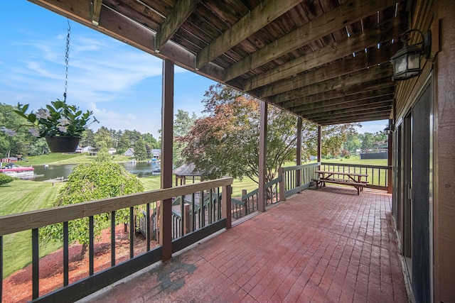 490 Skyline Dr, Horton, MI 49246 - view of patio / terrace with a water view and view of scattered trees