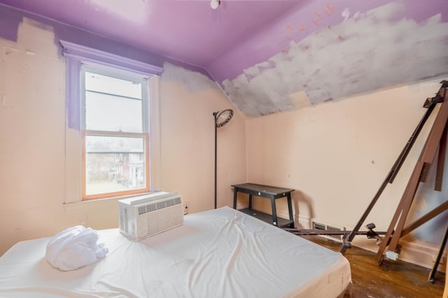 2251 Cortland St, Detroit, MI 48206 - bedroom with visible vents, lofted ceiling, wood finished floors, and a wall unit AC