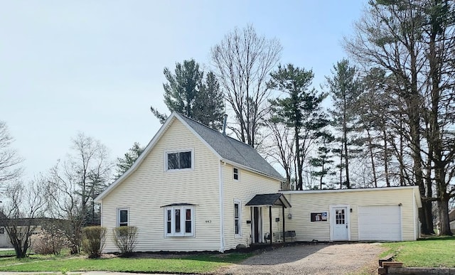 exterior space featuring a lawn, driveway, and a garage