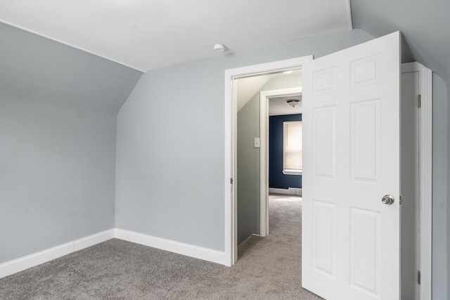 bonus room featuring baseboards, lofted ceiling, and carpet