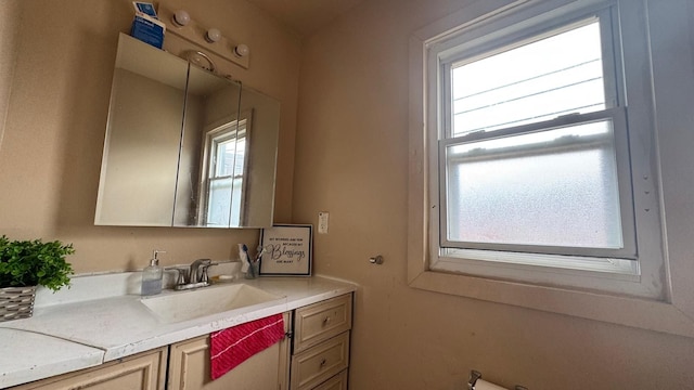 bathroom with vanity and a healthy amount of sunlight