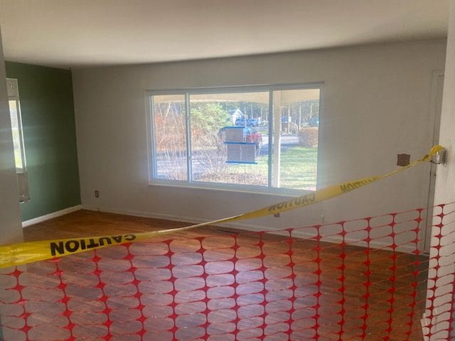 6111 Woodmoor Dr, Burton, MI 48509 - empty room with baseboards