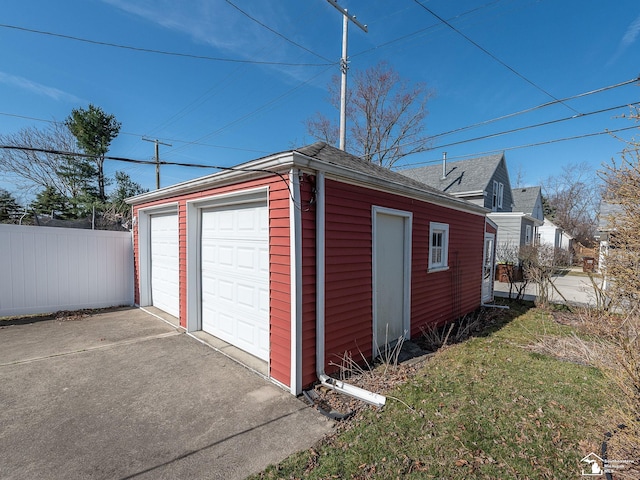 detached garage with fence