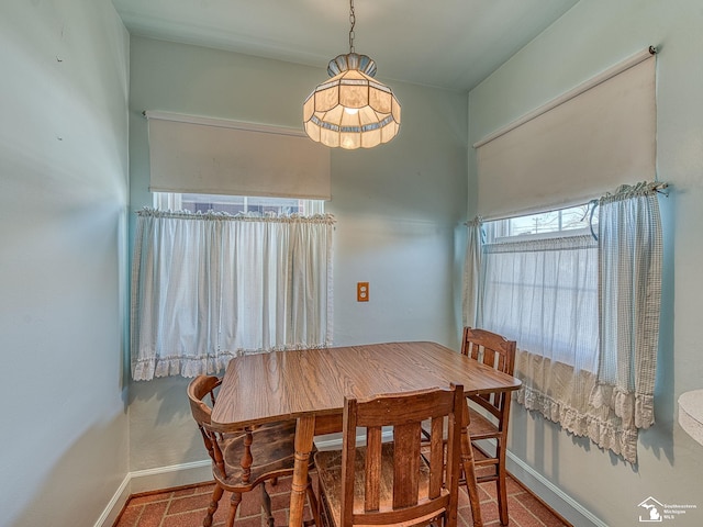 dining room with baseboards