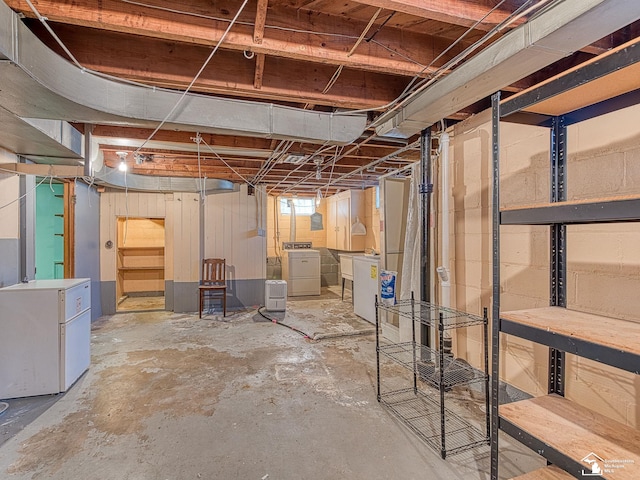 unfinished basement with washer and dryer