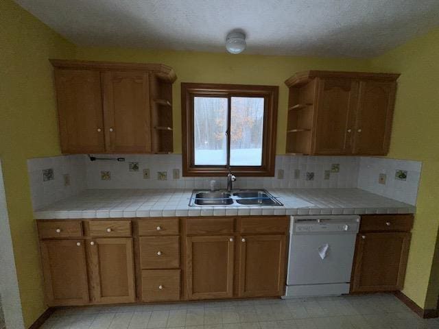 kitchen featuring dishwasher, a sink, tasteful backsplash, and open shelves