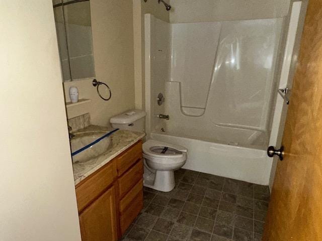 bathroom with toilet, shower / tub combination, and vanity