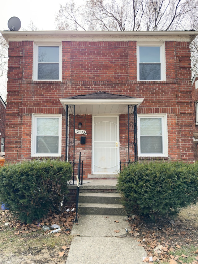 view of front of property featuring brick siding