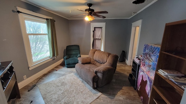 135 Handley St, Imlay City, MI 48444 - living area featuring baseboards, crown molding, wood finished floors, and plenty of natural light