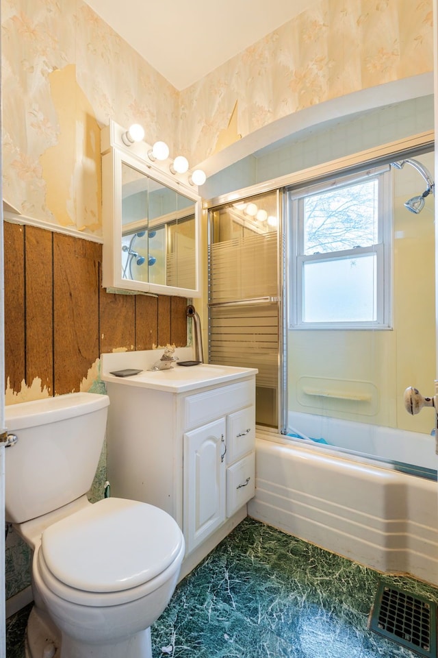 full bath featuring visible vents, wallpapered walls, a wainscoted wall, toilet, and vanity