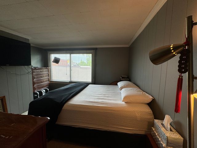 147 S Water St, Marine City, MI 48039 - bedroom featuring crown molding