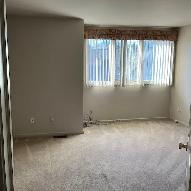 26766 Plumgrove Ln Unit 56, Farmington Hills, MI 48334 - empty room with carpet flooring and plenty of natural light