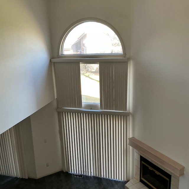 26766 Plumgrove Ln Unit 56, Farmington Hills, MI 48334 - stairway with plenty of natural light and a glass covered fireplace
