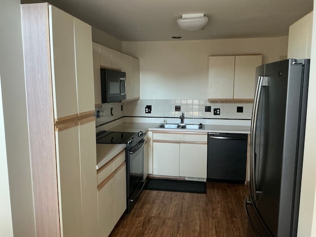 26766 Plumgrove Ln Unit 56, Farmington Hills, MI 48334 - kitchen featuring light countertops, backsplash, a sink, black appliances, and dark wood-type flooring