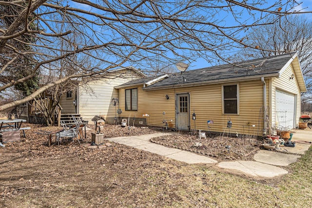 9448 Washburn Rd, Columbiaville, MI 48421 - back of house featuring a shingled roof