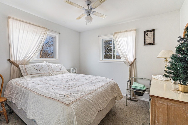 9448 Washburn Rd, Columbiaville, MI 48421 - bedroom with carpet flooring, a ceiling fan, baseboards, and multiple windows