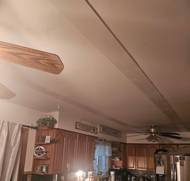 9448 Washburn Rd, Columbiaville, MI 48421 - room details with a ceiling fan and stainless steel fridge with ice dispenser