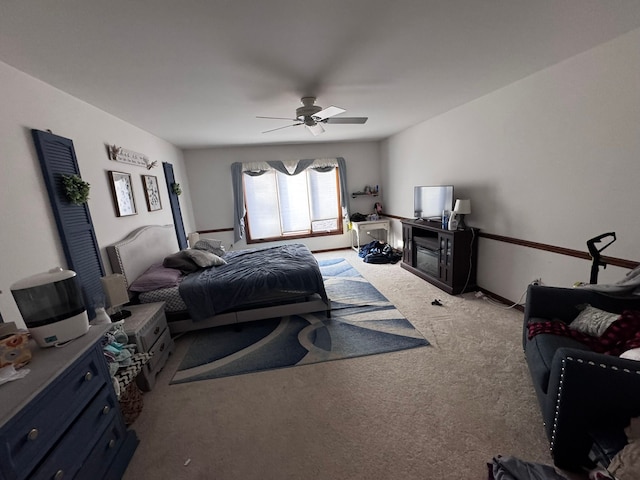 carpeted bedroom with a ceiling fan