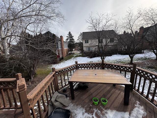 snow covered deck with outdoor dining space