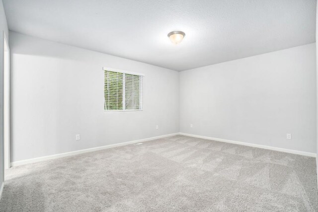 550 Needlewood Dr, Cedar Springs, MI 49319 - unfurnished room with carpet and baseboards