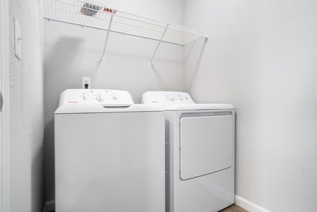 550 Needlewood Dr, Cedar Springs, MI 49319 - laundry room with washing machine and clothes dryer and baseboards
