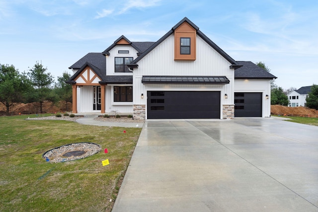 7865 Tessa Trl, Hudsonville, MI 49426 - modern farmhouse with a front lawn, driveway, a shingled roof, metal roof, and a standing seam roof