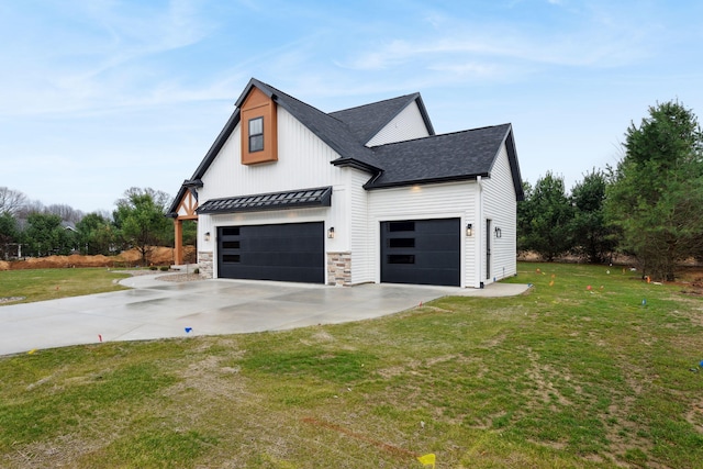 7865 Tessa Trl, Hudsonville, MI 49426 - view of side of property with an attached garage, a lawn, a shingled roof, and driveway