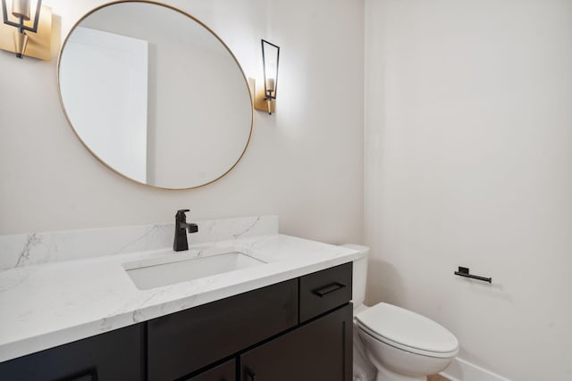 7865 Tessa Trl, Hudsonville, MI 49426 - bathroom with toilet, vanity, and baseboards