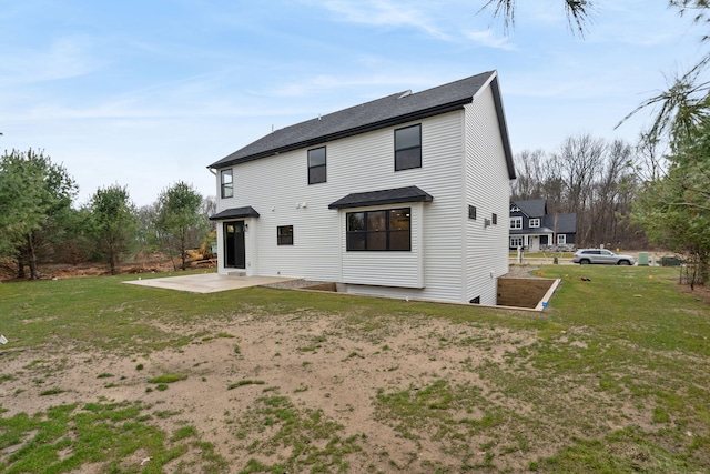 7865 Tessa Trl, Hudsonville, MI 49426 - rear view of property with a yard, a patio area, and a shingled roof