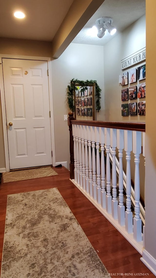 5393 Blaine Ave SE, Grand Rapids, MI 49508 - corridor with baseboards and wood finished floors