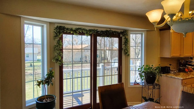 5393 Blaine Ave SE, Grand Rapids, MI 49508 - dining area with a chandelier