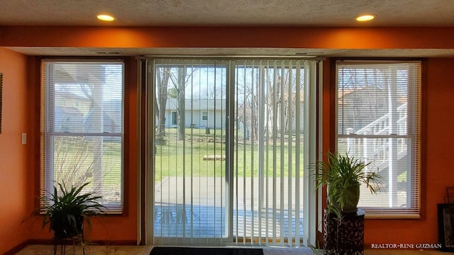 5393 Blaine Ave SE, Grand Rapids, MI 49508 - doorway featuring a wealth of natural light and a textured ceiling
