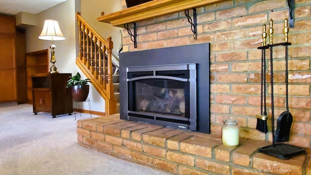 5393 Blaine Ave SE, Grand Rapids, MI 49508 - details featuring a fireplace and carpet floors