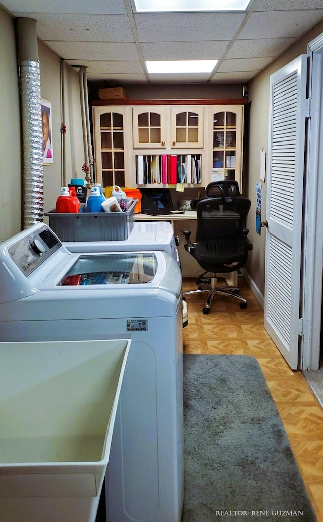 5393 Blaine Ave SE, Grand Rapids, MI 49508 - laundry room with parquet flooring, laundry area, and washing machine and dryer