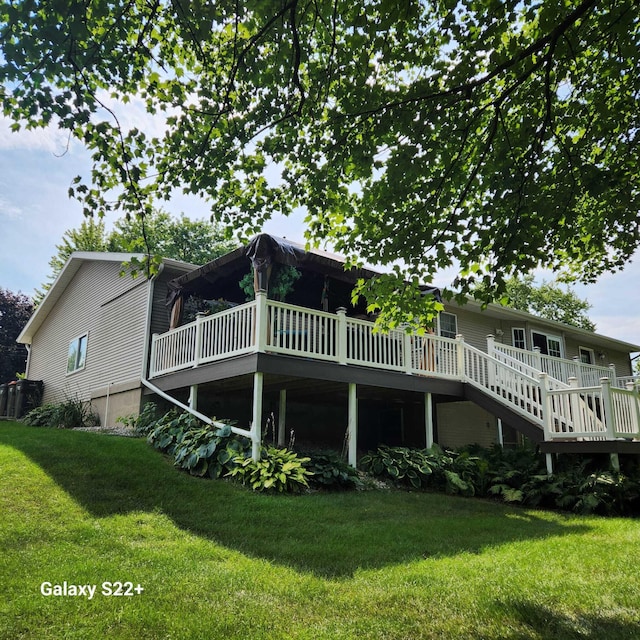 5393 Blaine Ave SE, Grand Rapids, MI 49508 - back of house with a yard and a wooden deck