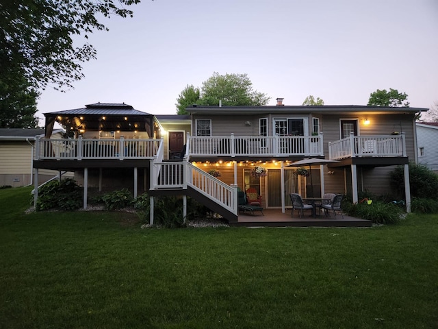5393 Blaine Ave SE, Grand Rapids, MI 49508 - back of property featuring a yard, a wooden deck, and stairs
