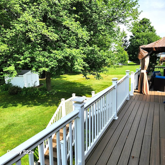 5393 Blaine Ave SE, Grand Rapids, MI 49508 - wooden deck featuring an outbuilding, a storage unit, and a yard