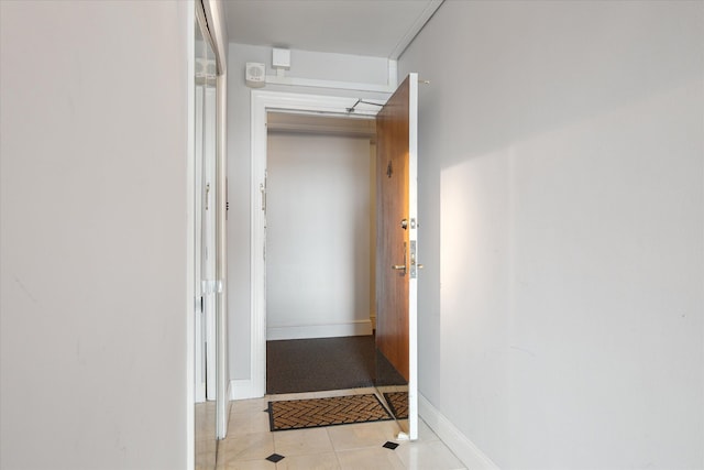 555 E William St, Ann Arbor, MI 48104 - hallway with baseboards and light tile patterned floors