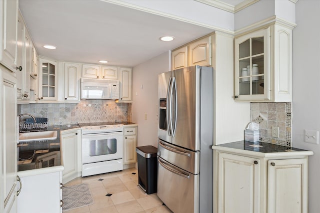 555 E William St, Ann Arbor, MI 48104 - kitchen with white appliances, a sink, tasteful backsplash, glass insert cabinets, and recessed lighting