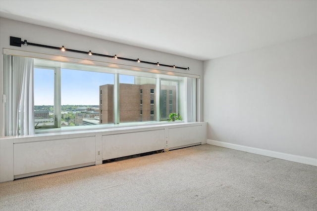 555 E William St, Ann Arbor, MI 48104 - carpeted spare room featuring baseboards