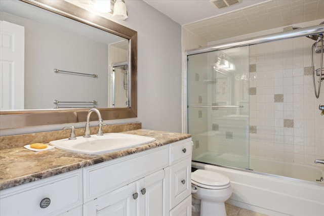 555 E William St, Ann Arbor, MI 48104 - full bathroom with toilet, vanity, enclosed tub / shower combo, and tile patterned floors